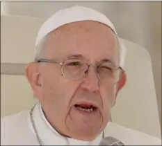  ??  ?? In this Sept. 26 file photo, Pope Francis delivers his message during his weekly general audience in St. Peter’s Square at the Vatican.AP Photo/AnDrew MeDIChInI