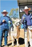  ?? PHOTOS: TONI SOMES ?? Riley Clancy, 14, from Pittsworth with reserve champion square meater steer Vesco Julius Caesar and owner Jo Van Elten from Prenzlau.