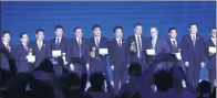  ?? ZOU HONG / CHINA DAILY ?? Winners and presenters of leading internet technology prize pose at a ceremony during the 4th World Internet Conference in Wuzhen, Zhejiang province on Sunday.