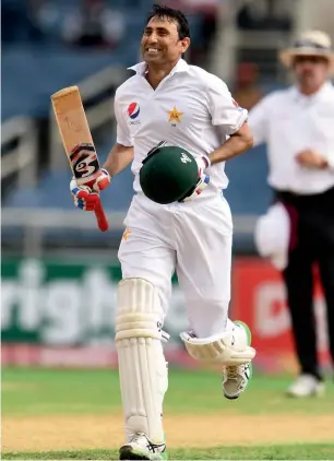  ?? AFP ?? Veteran cricketer Younis Khan celebrates after he became the first Pakistani batsman in Tests to complete 10,000 runs on Sunday. —