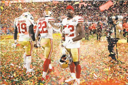  ?? Scott Strazzante / The Chronicle ?? 49ers Deebo Samuel, Matt Breida and D.J. Reed Jr. amid confetti that could have been theirs after losing 3120 to the Chiefs in Super Bowl LIV.