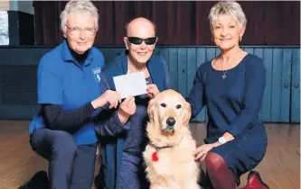  ??  ?? Carys Althoff-Roberts (right) with Guide Dogs Cymru volunteers Jan Wallace, Buddug Lloyd-Jones and golden retriever Freya