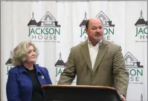  ?? The Sentinel-Record/Richard Rasmussen ?? A HAND UP: Jackson House Executive Director Janie Smith, left, listens as Hot Springs City Manager Bill Burrough announces the city’s Hope Works partnershi­p with the nonprofit Wednesday at The Greater Hot Springs Chamber of Commerce. The pilot program borrowed from other cities will offer the poor and homeless minimum wage to pick up litter on the city’s most trafficked streets.