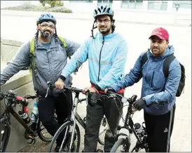  ?? JAMES MILLER/The Okanagan Sunday ?? The “Ask Islam” bike team, from left, Salman Khan, Bilal Bajwa and Naveed Ahmed, take a breather during a stop in Penticton.