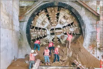  ?? Irfan Khan Los Angeles Times ?? A BORING machine for the $2.06-billion, 8.5-mile Crenshaw Line breaks through at a station site in 2016.