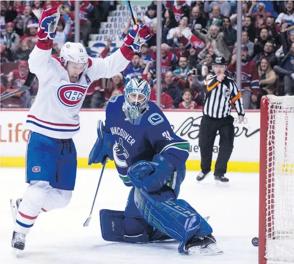  ?? — CP FILES ?? Montreal Canadiens winger Brendan Gallagher, left, celebrates teammate Daniel Carr’s goal past Canucks goalie Anders Nilsson during Tuesday’s game in Vancouver. It was a too-familiar scene of late as the Canucks have given up 36 goals in seven games.