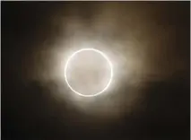  ?? SHUJI KAJIYAMA — THE ASSOCIATED PRESS ?? An annular solar eclipse, better known as a “ring of fire,” is viewed in Yokohama, Japan, in 2012. A similar eclipse can be viewed Saturday.