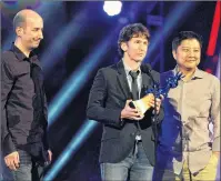  ?? AP PHOTO ?? In this December 2011 file photo, Todd Howard, centre, of Bethesda Game Studios, is joined by members of his team as he accepts the award for game of the year for “The Elder Scrolls V: Skyrim” at Spike TV’s Video Game Awards in Culver City, Calif.