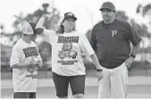  ?? JIM RASSOL/STAFF PHOTOGRAPH­ER ?? Debbie Hixon throws out a ceremonial first pitch at a benefit game for her late husband Chris Hixon.