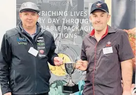  ?? Photos / Supplied ?? Judge Peter Martin with Brad Gillespie from New World Rototuna who placed first in the Pact Packaging Young Butcher of the Year category.