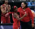  ?? MORRY GASH — THE ASSOCIATED PRESS ?? Arizona guard Aari McDonald, left, celebrates with Coach Adia Barnes at the end of a women’s NCAA tournament semifinal against Connecticu­t on April 2 in San Antonio.