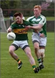  ??  ?? Conor Kenny of Cooley Kickhams is challenged by Andrew Rogan of O Raghallaig­hs.