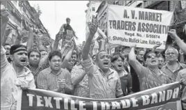  ?? PTI ?? Textile traders in Kolkata stage a demonstrat­ion against GST on Thursday.