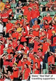  ?? ?? Wales’ ‘Red Wall’ of travelling supporters