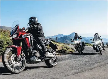  ?? Honda ?? THE HONDA Africa Twin is a classic dual sport, splitting its emphasis about halfway between off-road-ready and highway-happy. The AT feels solid bumping along a dirt road and tackling some light single-track duty.