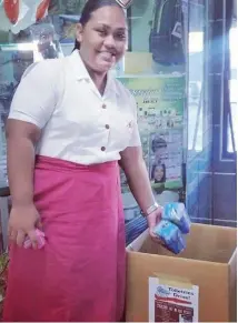  ??  ?? AnnMary Raduva of Adi Cakobau School dropping of some toiletries for her fellow students.