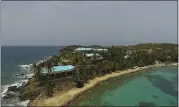  ?? GIANFRANCO GAGLIONE – THE ASSOCIATED PRESS ?? This video frame grab Tuesday shows an aerial view of Little St. James Island, in the U.S. Virgin Islands, a property purchased by Jeffery Epstein more than two decades ago. Epstein built on the island a stone mansion with creamcolor­ed walls and a bright turquoise roof surrounded by several other structures, including the maids’ quarters and a massive square-shaped white building on one end of the island.