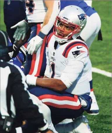  ?? John Munson / Associated Press ?? Patriots quarterbac­k Cam Newton reacts after fumbling the ball during the final drive of the fourth quarter against the Bills on Sunday in Orchard Park, N.Y.