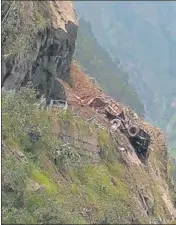  ?? AFP ?? An HRTC bus wrecked by a landslide on the Reckong Peo-Shimla highway on Wednesday.