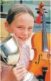  ??  ?? Thea Robertson of Caol won the intermedia­te fiddle competitio­n.