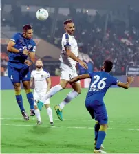  ?? PTI ?? Gerson Vieira (No. 4) of Mumbai City’s and Chennaiyin’s Eli Filho (white jersey) clash during their ISL Match on Wednesday. —