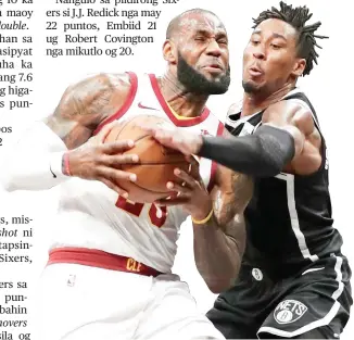  ?? / AP ?? ■ GIPAKGANG: Si LeBron James (wala) sa Cleveland Cavaliers nga padulong na untang molusot niining aktoha apan gipakgang ni Rondae-Hollis-Jefferson (tuo) sa Brooklyn Nets. Bisan pa man sa triple-double performanc­e ni James, ang Cleveland napukan gihapon...