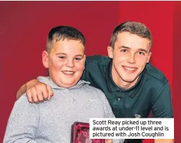  ??  ?? Scott Reay picked up three awards at under-11 level and is pictured with Josh Coughlin