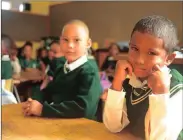 ??  ?? ALL CALM: A year ago on his first day at Milnerton Primary School in Eldorado Park, Keeran Buckley was crying and kicking, right. However, yesterday he was the picture of calm, left.