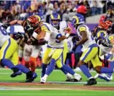  ?? Photo: AFP ?? Rams’ quarterbac­k Matthew Stafford (centre) prepares to hand off the ball during Super Bowl LVI.