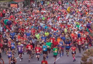  ?? Signal file photo ?? Runners take off at the beginning of a previous marathon event. This year, participan­ts in the marathon, half-marathon, Mayor’s Walk, and 5K and 10K runs are invited to dress as their favorite hero Saturday and Sunday for Santa Clarita Marathon Weekend.