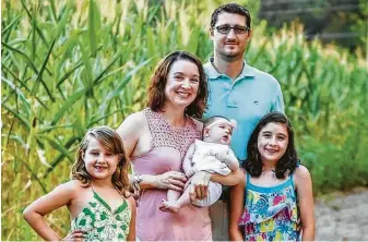  ?? Emily Wright / TNS ?? Reagan Wright, 13, right, with parents Joe and Emily, sister Macy and baby sister Bella. Reagan has autism spectrum disorder, but finding a medical provider in South Carolina is difficult.