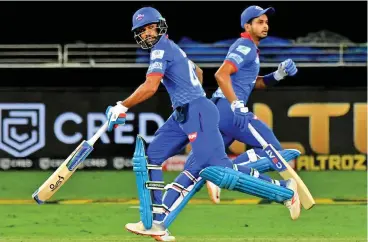  ??  ?? Delhi Capitals’ Shikhar Dhawan (left) and captain Shreyas Iyer run a single during their match against Rajasthan Royals in Dubai on Wednesday