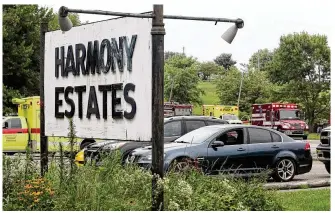  ?? BILL LACKEY/ STAFF ?? Medic units on July 24, 2022, wait at the entrance to Harmony Estates just east of Springfiel­d near the mobile home of Cole White. Deputy Matthew Yates was shot responding to a 911 call.