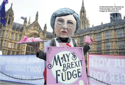  ??  ?? A demonstrat­or dressed as Theresa May sells Brexit Fudge at Westminste­r