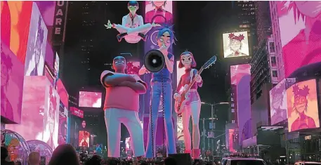  ?? | PHOTO : WARNER ?? Le groupe virtuel Gorillaz, animé par Jamie Hewlett et Damon Albarn, lors d’un concert à New York.