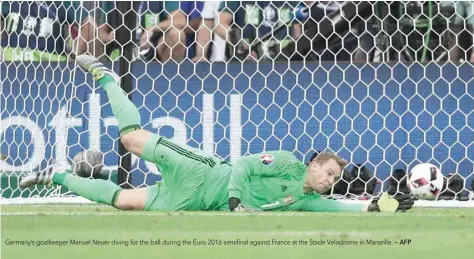  ?? — AFP ?? Germany’s goalkeeper Manuel Neuer diving for the ball during the Euro 2016 semifinal against France at the Stade Velodrome in Marseille.