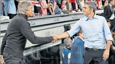  ?? ?? Pellegrini y Valverde se saludan antes del partido Athletic-Betis de la primera vuelta.