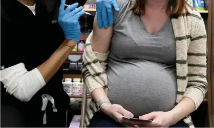  ?? Photograph: Hannah Beier/Reuters ?? Australian healthcare profession­als are bracing for unvaccinat­ed pregnant women to be among the many patients seriously ill with Covid.