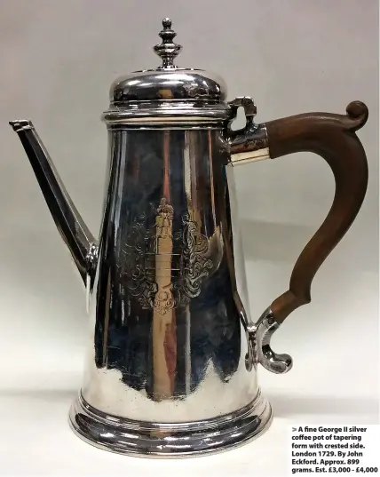  ?? ?? > A fine George II silver coffee pot of tapering form with crested side. London 1729. By John Eckford. Approx. 899 grams. Est. £3,000 - £4,000