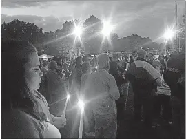  ?? [MATT SANCTIS/COX MEDIA OHIO GROUP] ?? Champaign County residents fill a small community park in North Lewisburg on Thursday to offer spiritual support for the family of Jacob Drake, who had been missing since Monday after a crash involving the USS John S. McCain.