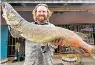  ?? DEPARTMENT OF GAME & FISH ?? Nick Streit of Taos caught a 45-inch northern pike Oct. 19 at Eagle Nest Lake. He was using a size 8 wooly bugger on an eight-pound tippet.