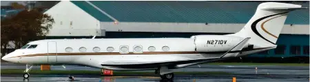  ?? ?? Touchdown in Scotland: The £4 million Gulf Stream private jet used by billionair­e Amazon founder Jeff Bezos, pictured right