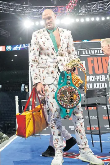  ?? REUTERS ?? Tyson Fury poses with his WBC heavyweigh­t belt after dethroning Deontay Wilder.
