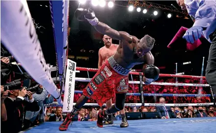  ?? GETTY IMAGES ?? Deontay Wilder is heading for the canvas after being knocked out by Tyson Fury in the 11th round of their WBC heavyweigh­t title fight at T-mobile Arena in Las Vegas.