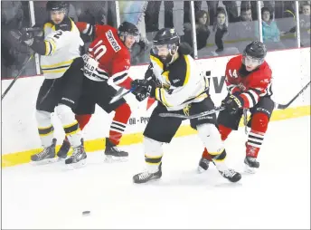  ?? SAM MACDONALD/THE NEWS ?? Pictou County Scotians’ Ian Keating tries to check Giordano Saputo in Game 5 on Sunday.