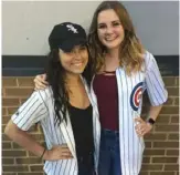  ?? Vince Adamo via Associated Press ?? White Sox fan Gabby Adamo, left, and her friend, Cubs fan Emily Heerde, celebrate Adamo’s 20th birthday at a meeting of the crosstown rivals.