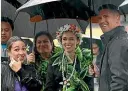  ?? STUFF, GETTY ?? Jacinda Ardern was sheltering from the weather at yesterday’s Pasifika Festival in Auckland, above, but since Cook Island PM Mark Brown met Foreign Affairs Minister Nanaia Mahuta last week, left, there has been plenty of stormy talks about bubbles. Below, Mii Hinarere Tupangaia, president of the Hutt Valley Cook Islands Associatio­n.