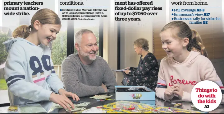  ?? Photo / Greg Bowker ?? Electricia­n Mike Muir will take the day off to look after his children Ruby, 8, (left) and Emily, 10, while his wife Anna goes to work.