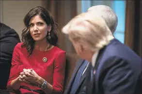  ?? Drew Angerer / TNS ?? South Dakota Gov. Kristi Noem, left, speaks as President Donald Trump listens during a meeting at the White House in Washington, D.C., on Dec. 16, 2019.