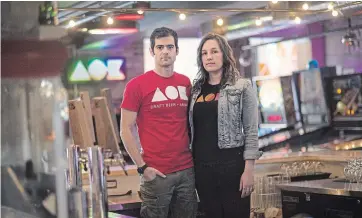 ?? MATHEW MCCARTHY WATERLOO REGION RECORD ?? Steve Jenereaux, left, and Dani Stock are the owners of AOK Craft Beer + Arcade in downtown Kitchener.